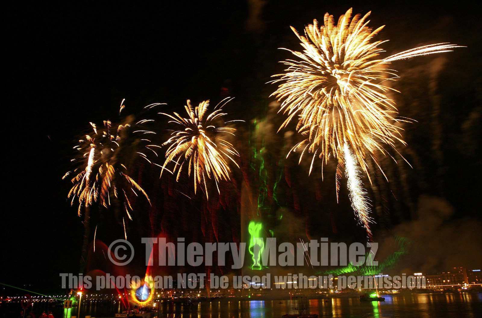 03_2272D ©Th.Martinez .Geneva , Switzerland. America's Cup 2003. 8th March 2003.Alinghi Team winner of America's Cup 2003..Welcome to Alinghi Team in Geneva.Firework and laser show by the lac...