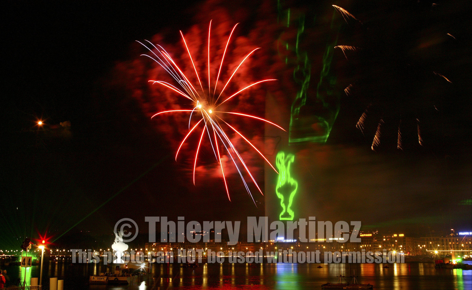 03_2276D ©Th.Martinez .Geneva , Switzerland. America's Cup 2003. 8th March 2003.Alinghi Team winner of America's Cup 2003..Welcome to Alinghi Team in Geneva.Firework and laser show by the lac...