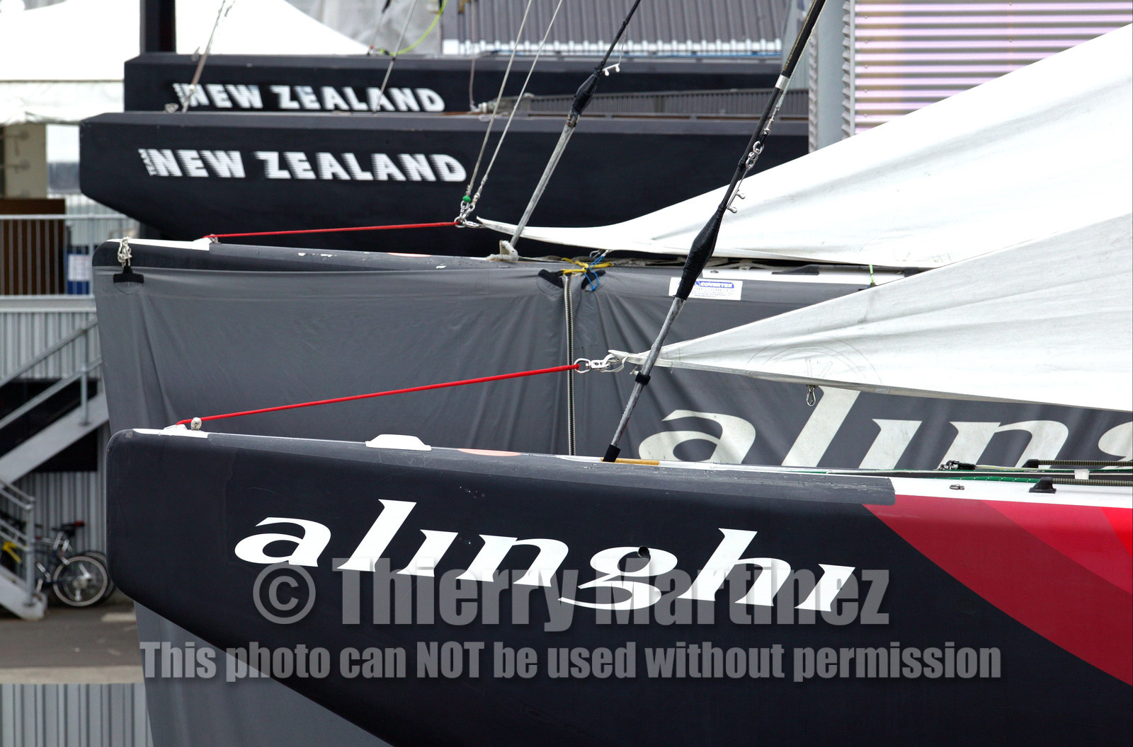 03_1035D © Th.Martinez. Auckland   New Zealand. 22th February 2003 America's Cup 2003. Race cancelled for lack of wind. Defender (Team New Zealand) and Challenger (Alinghi Team)let thier boats in the shed.