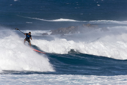 Stand Up Paddle  in waves at Hookip'a Beach - North Shore Maui - Hawaii.