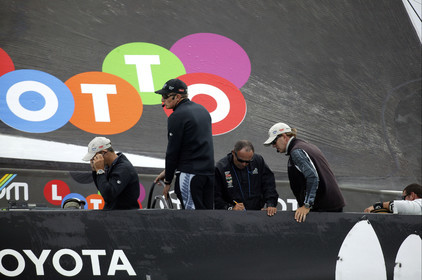 03_0243D ©Th.Martinez - Auckland (NZ) . America's Cup 2003. 20th February 2003. Day 4 Cancelled..Alinghi (SUI 64) vs Team NZ (NZL 82) .Team NZ's skipper Dean Barker at the helm of NZL 82, with frenchman Bertrand Pace , just behind Dean Barker,(Tactician, on place of Hamish Pepper) for first time on board for America's Cup. Bertrand Pace is the first French sailor to race in n America's Cup match and is the helmsman of NZL 81. The race had been cancelled for wind not enough stable. Race 4 should start on Saturday 22th February...