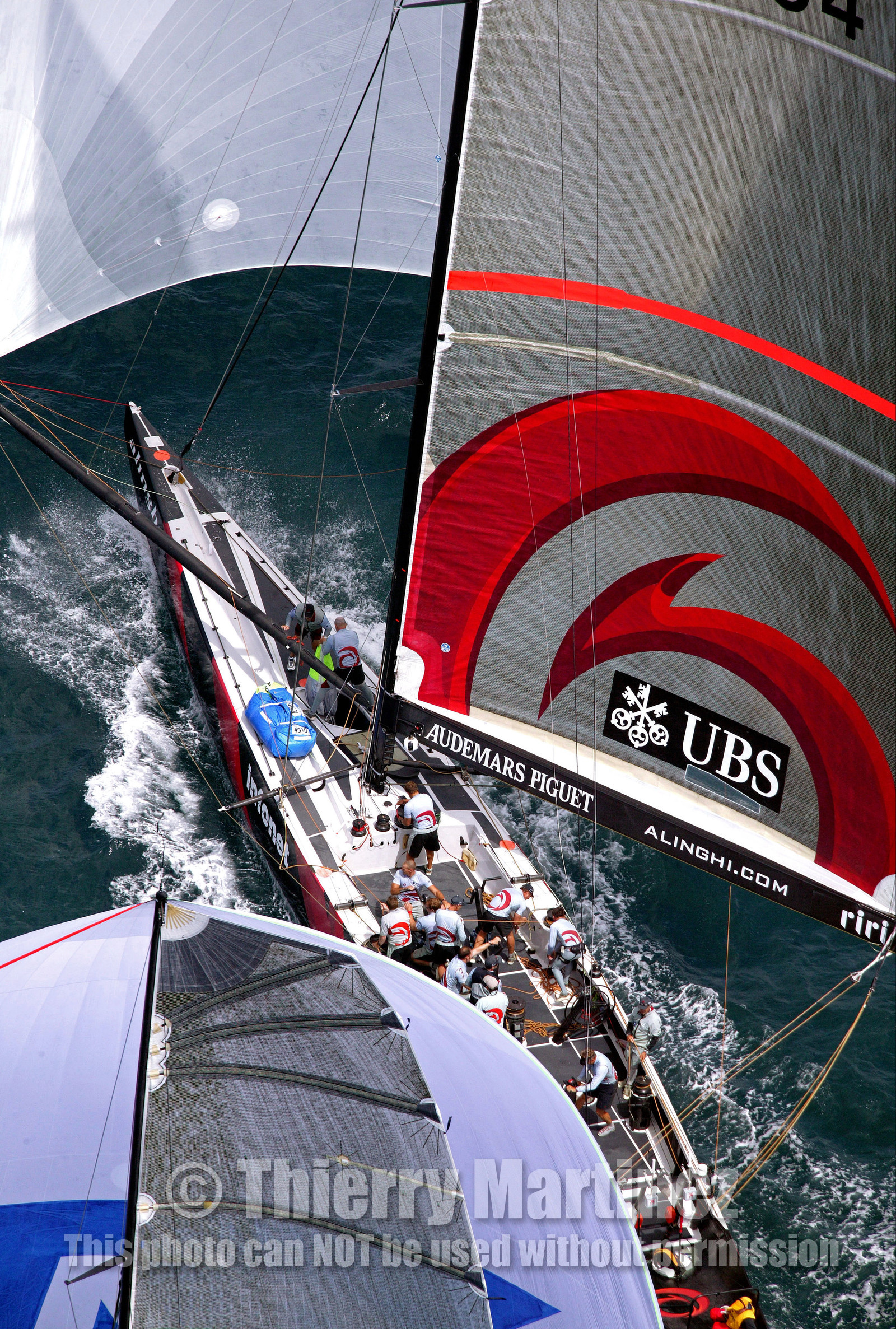 03_0976D © Th.Martinez . Auckland   New Zealand. 18th February 2003 America's Cup 2003, Day 3 Alinghi(SUI64) vs Team New Zealand(NZL82).Alinghi Team leading NZL 82 in last downwind leg.