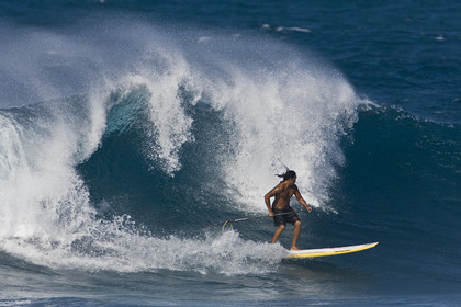 Stand Up Paddle  in waves at Hookip'a Beach - North Shore Maui - Hawaii.
