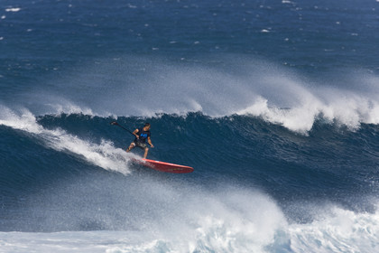 Stand Up Paddle  in waves at Hookip'a Beach - North Shore Maui - Hawaii.