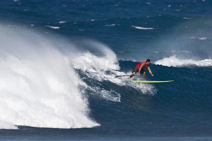 Stand Up Paddle  in waves at Hookip'a Beach - North Shore Maui - Hawaii.