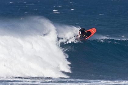 Stand Up Paddle  in waves at Hookip'a Beach - North Shore Maui - Hawaii.