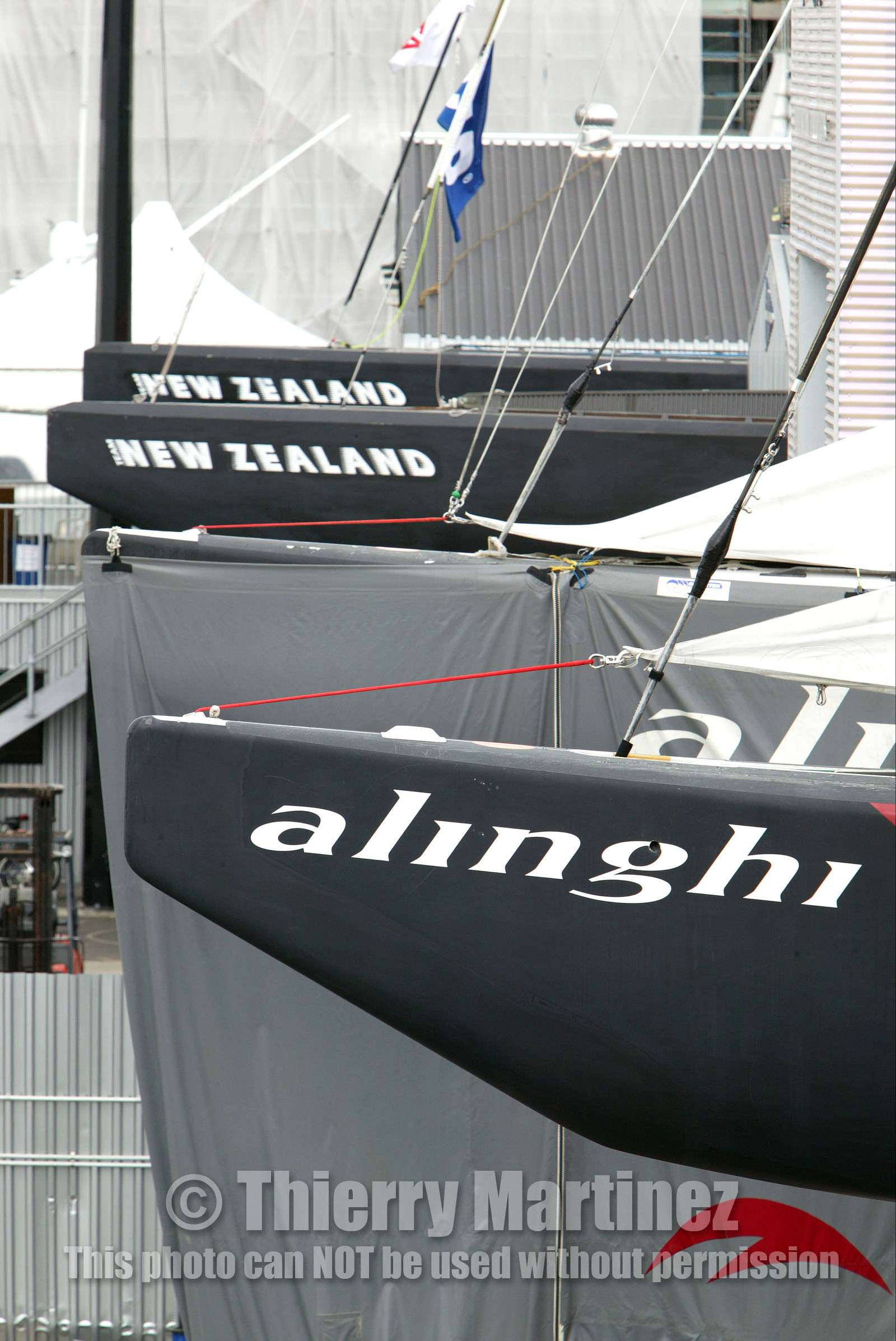 03_1037D © Th.Martinez. Auckland   New Zealand. 22th February 2003 America's Cup 2003. Race cancelled for lack of wind. Defender (Team New Zealand) and Challenger (Alinghi Team)let thier boats in the shed.