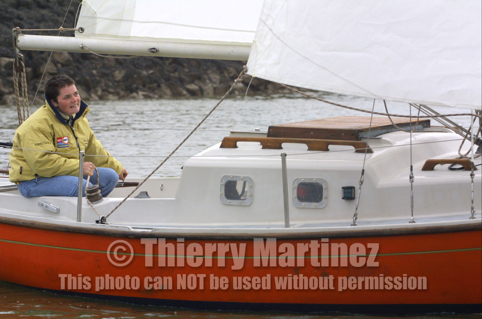 ©ThMartinez. Vendee Globe Finish..Ellen MacArthur (UK) KINGFISHER sailing on the small boat which she did round Briatin .when she was 16 years old. It's the first time since 5 years, she was ailing that boat..Ellen was very happy . Her team did a surprise to Ellen when they carries the boat from UK to .the Vendee Globe finish.
