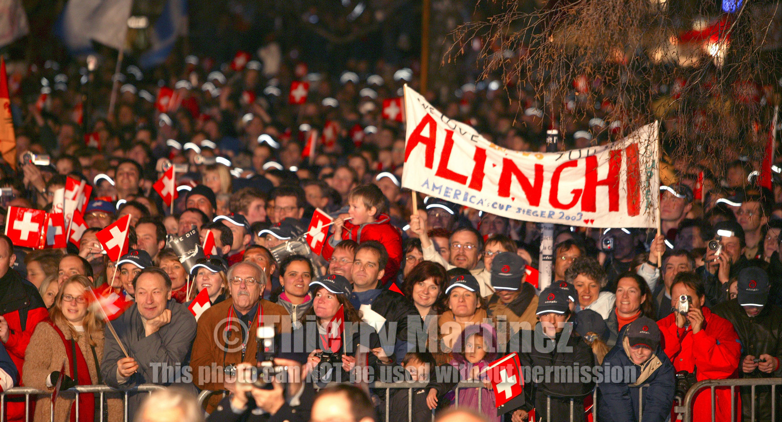03_2257D ©Th.Martinez. Geneva , Switzerland. America's Cup 2003. 8th March 2003.Alinghi Team winner of America's Cup 2003..Welcome to Alinghi Team in Geneva. Alinghi supporters at La Rotonde..