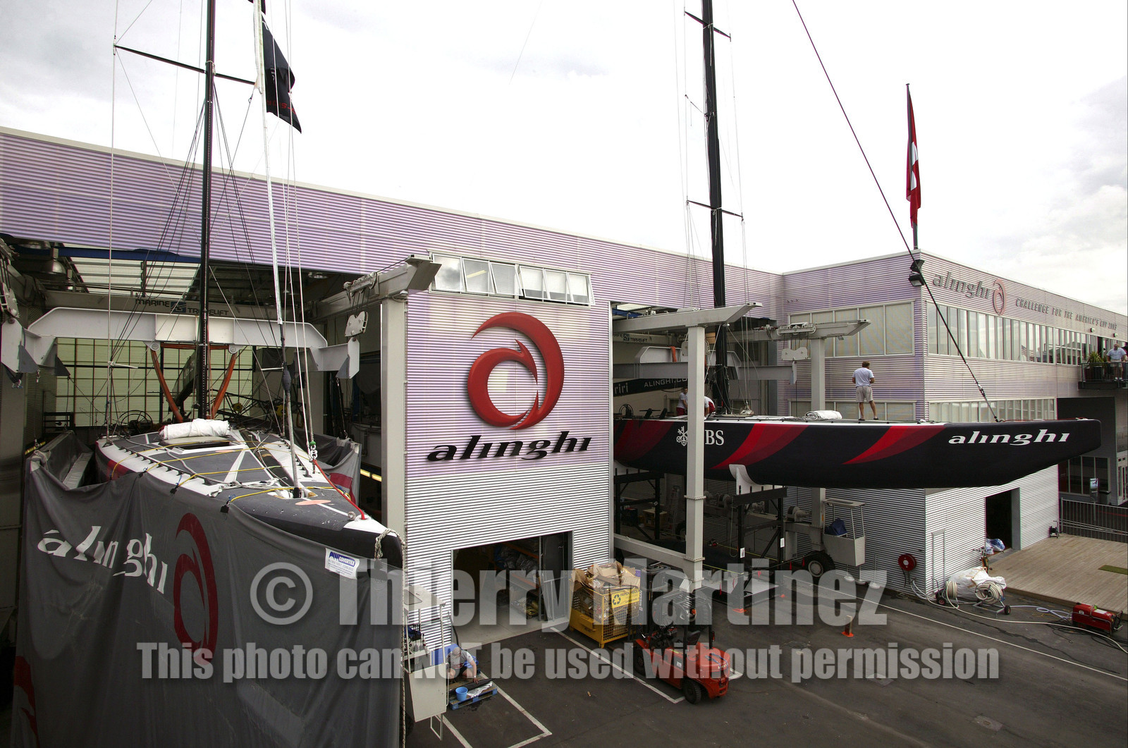 03_1062D © Th.Martinez Auckland   New Zealand. 24th February 2003  America's Cup 2003. Day 4, Race cancelled lack of wind. Alinghi (SUI64) vs Team New Zealand (NZL82)For fourth times in row race day 4 of the America's Cup 2003 have been cancelled . The two race boats (SUI 75 on left and SUI 64)have been left in sheds..