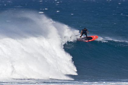 Stand Up Paddle  in waves at Hookip'a Beach - North Shore Maui - Hawaii.