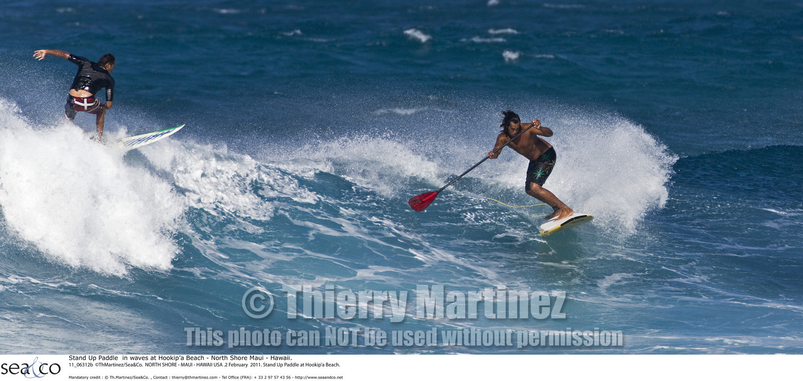 Stand Up Paddle  in waves at Hookip'a Beach - North Shore Maui - Hawaii.