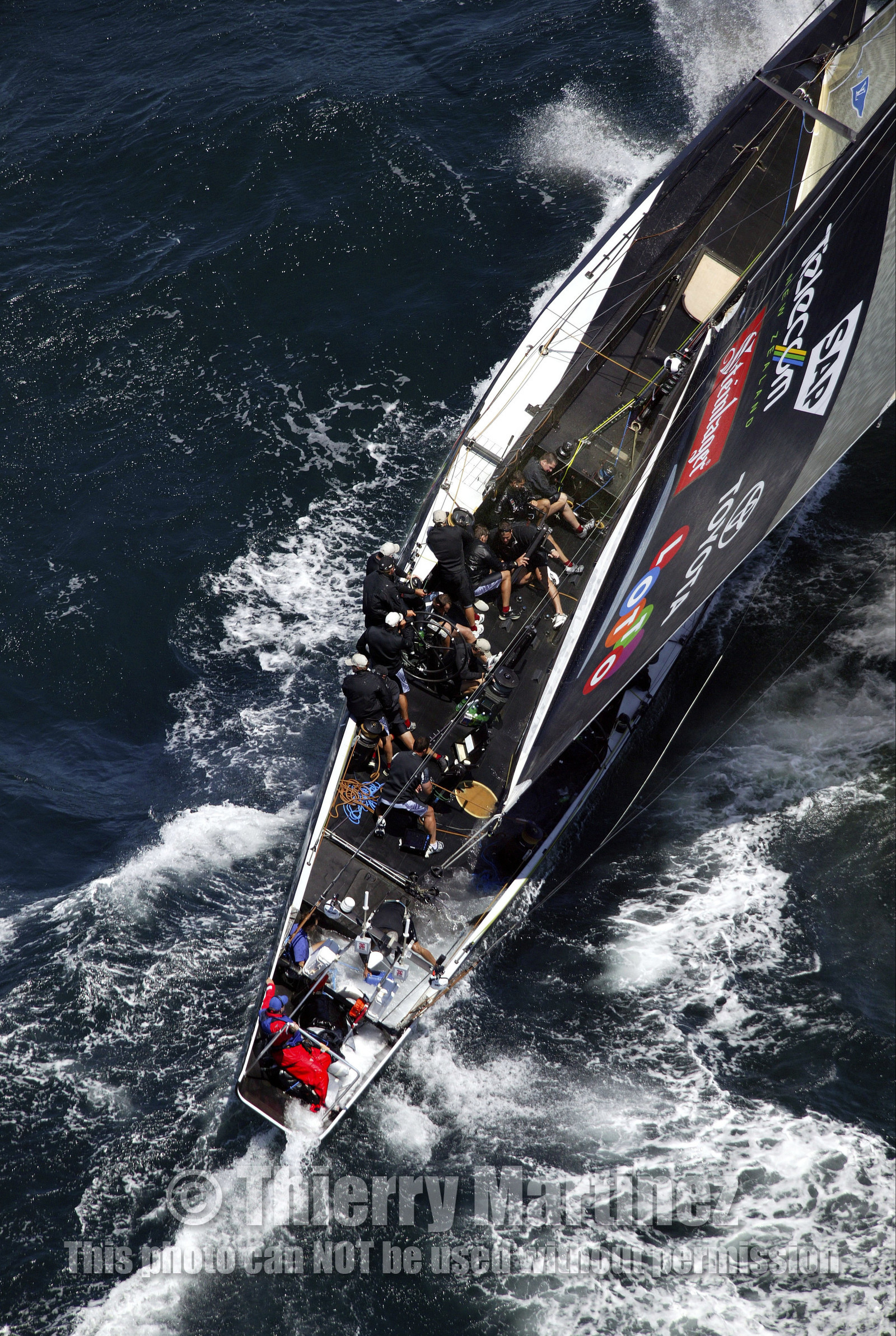 03_0164D ©Th.Martinez - Auckland (NZ) . America's Cup 2003. 15th February 2003. Day 1..Alinghi (SUI 64) vs Team NZ (NZL 82) .NZL 82 in first minutes of Race 1 before retiring on damage. Alinghi 1- Team NZ 0.