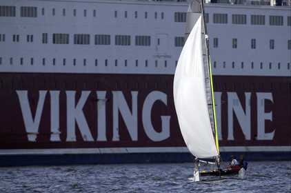 03_3272D © Th.Martinez,STOCKHOLM SWEDEN, 11 07 03-Archipelago Raid (2003) Day 4, last leg..ASSA ABLOY Neal and Lisa McDonald (UK) passing by a ferry in Sokholm harbour.