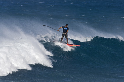 Stand Up Paddle  in waves at Hookip'a Beach - North Shore Maui - Hawaii.