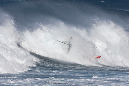 Stand Up Paddle  in waves at Hookip'a Beach - North Shore Maui - Hawaii.