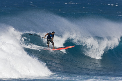 Stand Up Paddle  in waves at Hookip'a Beach - North Shore Maui - Hawaii.